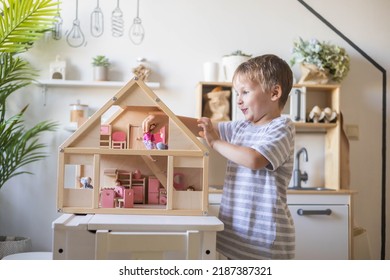 Cute Male Kid Playing Toy Doll House Characters With Interior Furniture Montessori Wooden Eco Friendly Material Early Development Educational Game. Child Boy With Natural Playthings Construction