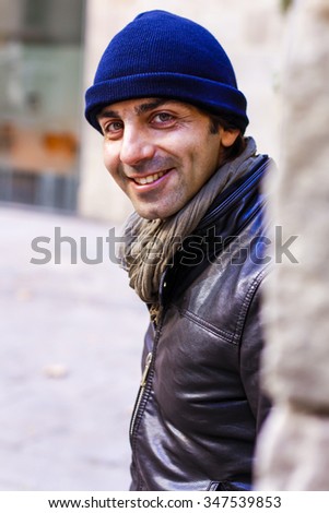 Cute man smiling with a hat