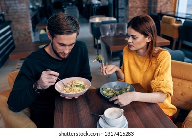 Cute Men And Women Eat In The Restaurant Romantic Communion Dinner