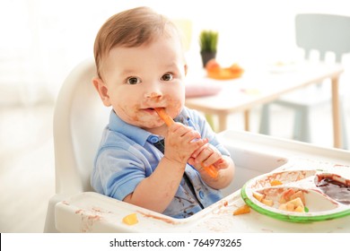 Cute Messy Baby Eating Puree At Home