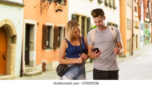 Cute Millennial Couple Travelling Through A New Town