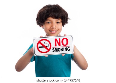 Cute mixed race kid holding no smoking sign. Isolated on white background.