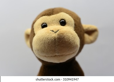 Cute Monkey Toy Shot On White
