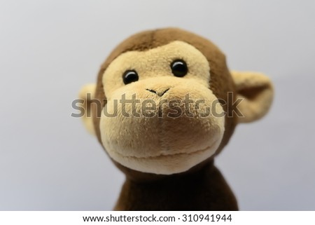 Cute monkey toy shot on white
