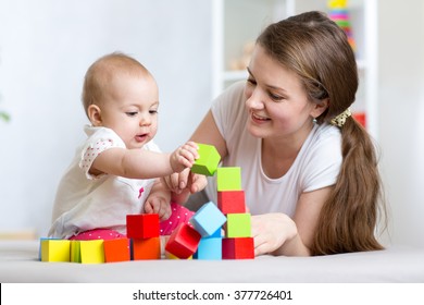 Cute Mother And Child Boy Play Together