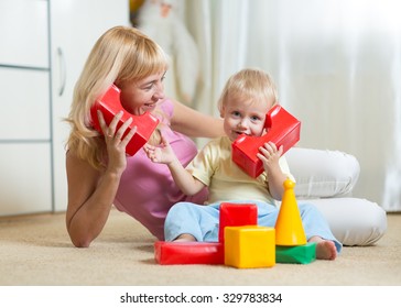 Cute Mother And Kid Boy Role Playing Together Indoor