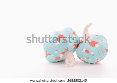 Cute multicoloured handmade pumpkins; textile home decore. Halloween preparations concept.