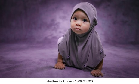 Cute Muslim Baby Girl Portrait In Studio.