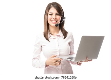 Cute And Nerdy Young Woman With A Laptop Computer Working As A Tech Support Rep In A Call Center