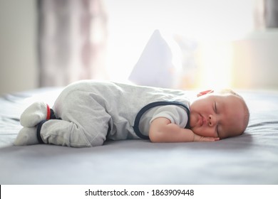 Cute Newborn Baby About Two Months Old Sleep On Stomach On Bed At Home. Mixed Race Asian-German Infant Boy Day Sleeping.