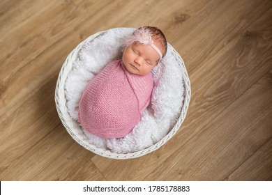 Cute Newborn Baby In A Basket