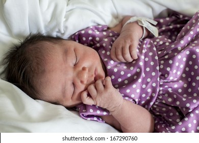 Cute Newborn Baby in Purple Polka dot dress
