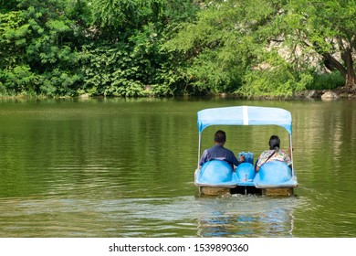 Cute Old Lover Couple Playing A Water Bike In The Nature Lake.