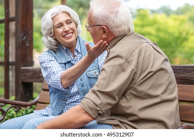 Cute Old Lovers Sitting On Bench