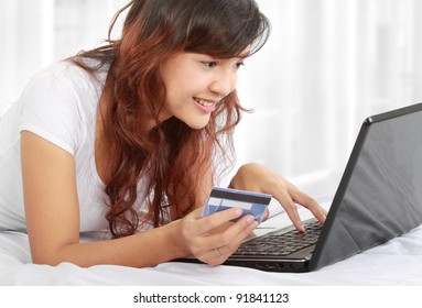 Cute Online Shopping Woman Lying On The Bed