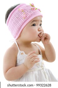 Cute Pan Asian Baby Girl Eating On White Background