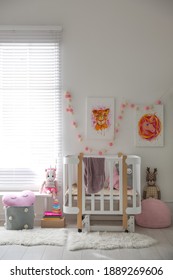 Cute Pictures And Crib In Baby Room Interior