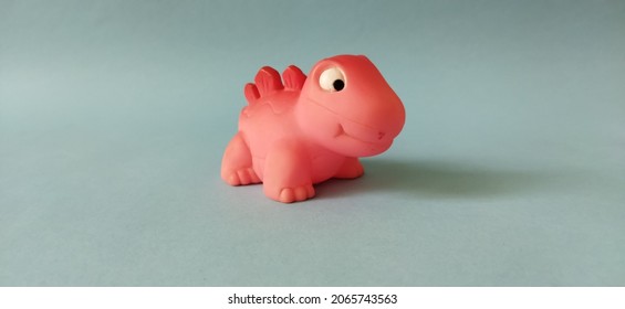 Cute Pink Dinosaur On Blue Manila Paper