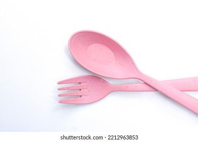 Cute Pink Fork And Spoon Isolated On White Background