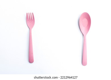 Cute Pink Fork And Spoon Isolated On White Background