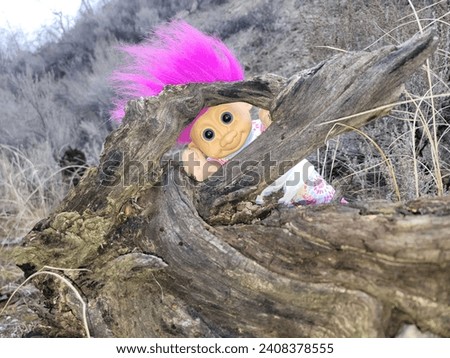 A cute pink haired troll playing hide and seek with you 