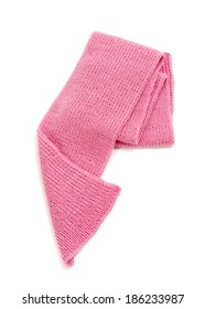 Cute pink winter scarf nicely arranged. Wool scarf isolated on white background.