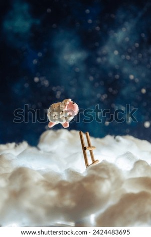 Cute plasticine sheep jumping over a fence in the clouds. Count sheep for insomnia. Night sky with stars. Foto stock © 