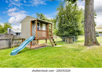 Cute Playhouse With Slide On Backyard