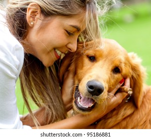 Cute portrait of a woman with her dog at the park
