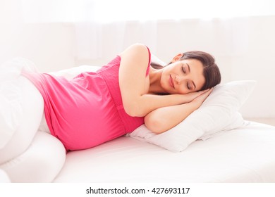 Cute pregnant woman is having a nap - Powered by Shutterstock