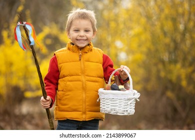 Cute preschool child, boy, holding handmade braided whip made from pussy willow, traditional symbol of Czech Easter used for whipping girls and women to receive eggs and sweets - Shutterstock ID 2143899067