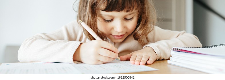 Cute Preschooler Girl Writing Maths, Learning Home. Education And Distance Learning For Kids. Homeschooling Concept. Photo Banner For Website Header Design