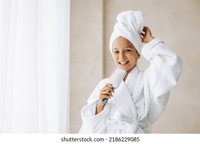 Cute Preteen Girl Singing Using Hair Brush As A Microphone