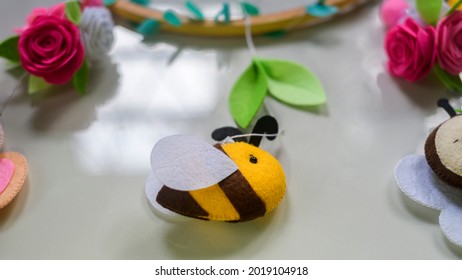 Cute Prop For Baby Cot Mobile Closes Up. Felt Plush Bees With Flowers Design.