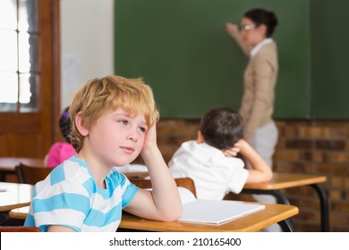 Cute Pupil Not Paying Attention In Classroom At The Elementary School