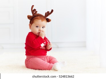 Cute Redhead Baby Eating Christmas Candy At Home