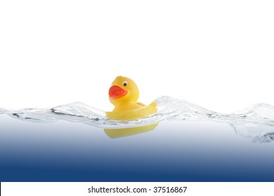 Cute Rubber Duckling Swimming In Water.