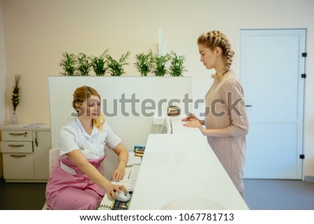 Similar – Carer wearing slippers to elderly female patient