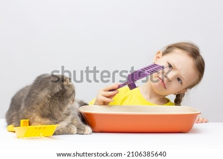 Cute sad girl do not care adout cat isolated on white background Stock photo © 
