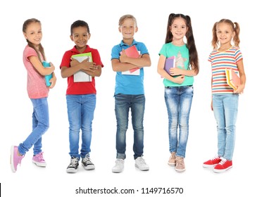 Cute School Children With Stationery On White Background