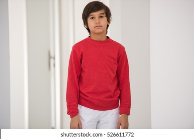 Cute school kid posing in studio with different facial expressions