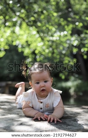 Similar – Happy little girl playing in a urban playground.