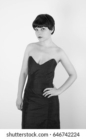 Cute Short Haired Model In Vintage Designer Minimal Prom Dress. Mod, Retro Style. Studio Fashion Shots. Model Is Wearing Her Mom's Prom Dress From The 80's. 