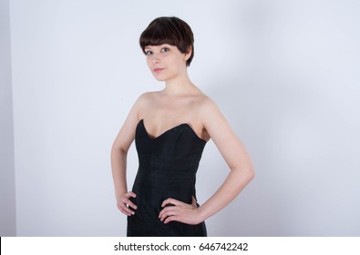 Cute Short Haired Model In Vintage Designer Minimal Prom Dress. Mod, Retro Style. Studio Fashion Shots. Model Is Wearing Her Mom's Prom Dress From The 80's. 