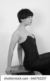 Cute Short Haired Model In Vintage Designer Minimal Prom Dress. Mod, Retro Style. Studio Fashion Shots. Model Is Wearing Her Mom's Prom Dress From The 80's. 