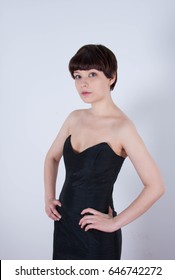 Cute Short Haired Model In Vintage Designer Minimal Prom Dress. Mod, Retro Style. Studio Fashion Shots. Model Is Wearing Her Mom's Prom Dress From The 80's. 