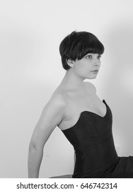 Cute Short Haired Model In Vintage Designer Minimal Prom Dress. Mod, Retro Style. Studio Fashion Shots. Model Is Wearing Her Mom's Prom Dress From The 80's. 