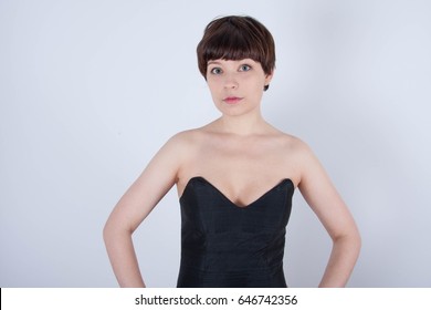 Cute Short Haired Model In Vintage Designer Minimal Prom Dress. Mod, Retro Style. Studio Fashion Shots. Model Is Wearing Her Mom's Prom Dress From The 80's. 