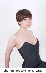 Cute Short Haired Model In Vintage Designer Minimal Prom Dress. Mod, Retro Style. Studio Fashion Shots. Model Is Wearing Her Mom's Prom Dress From The 80's. 