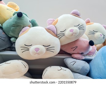 Cute Sleeping Cat Plush Pillow On The Shelf. Cat Sweet Dreams 